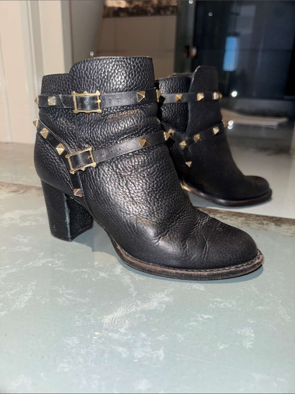 Valentino Garavani Black Leather Studded Ankle Boots with Gold Accents